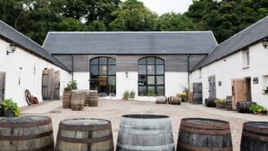 Nc'nean Distillery, credit Andy Bate. Distillery with barrels in foreground