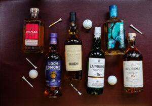 Whiskies of the Month for July. Themed with golf balls and tees.