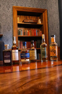 The 6 whiskies of the month are pictured in our Still house suite.